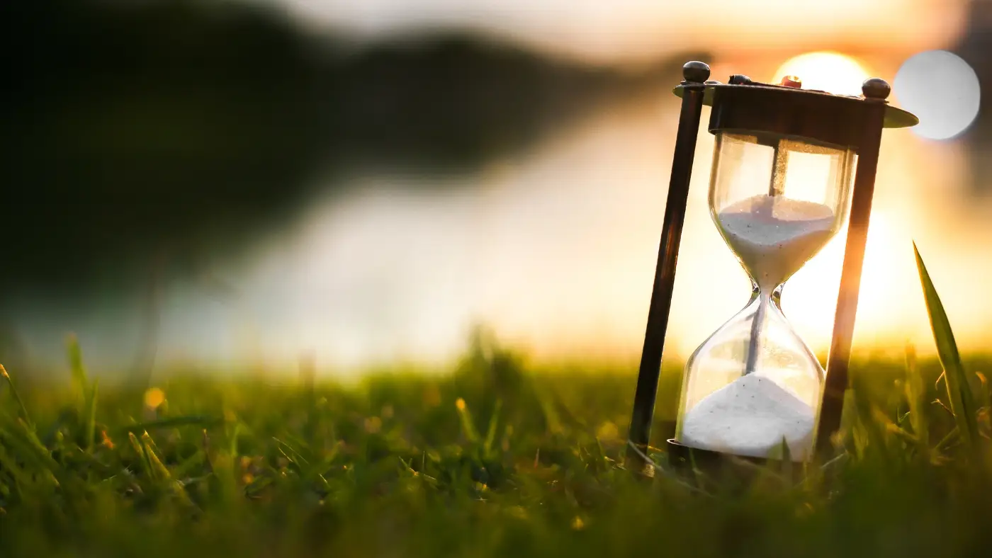 hourglass in grass