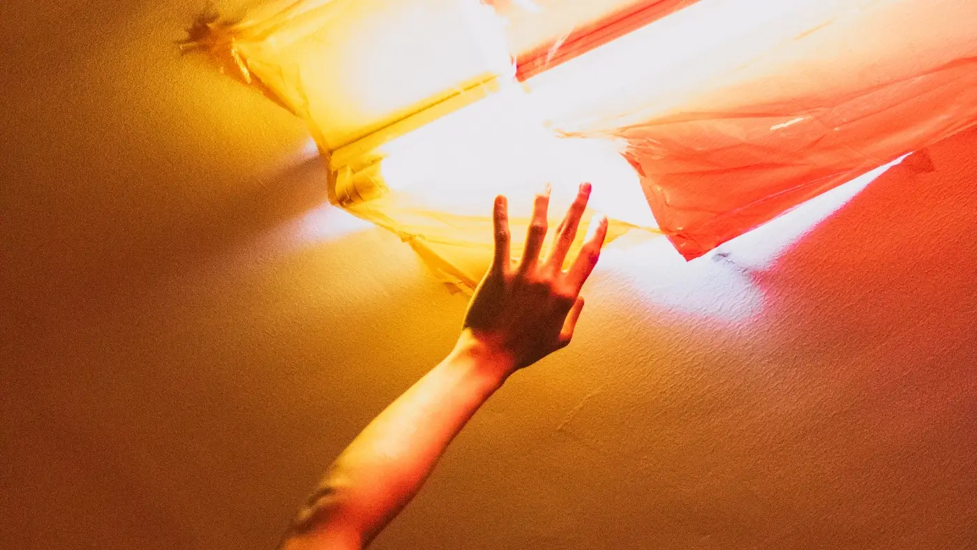 hand reaching up to the roof