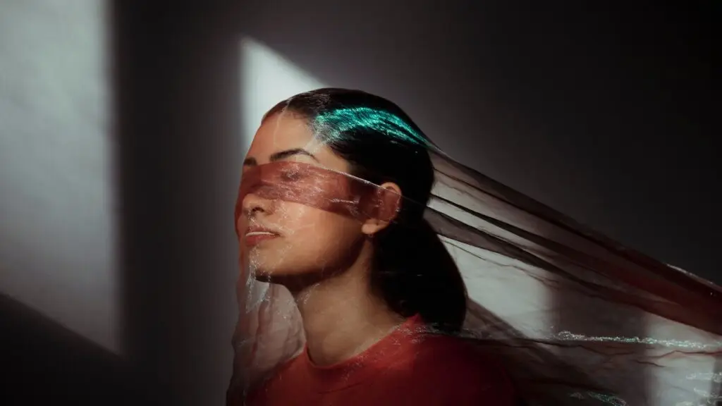 woman with gauze over face