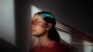 woman with gauze over face
