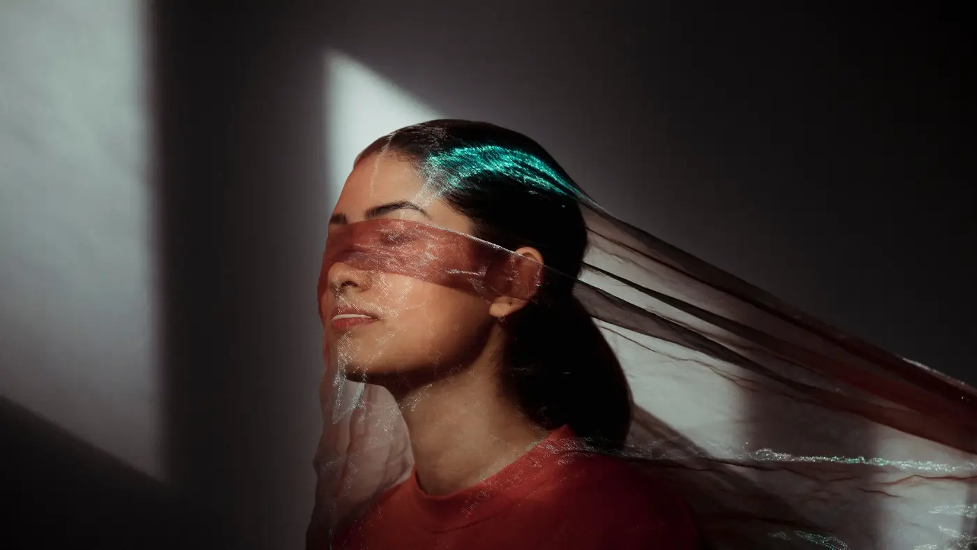 woman with gauze over face