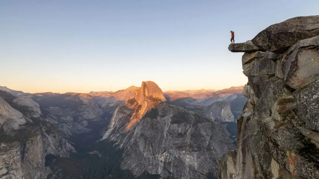 Person standing on the edge of a cliff