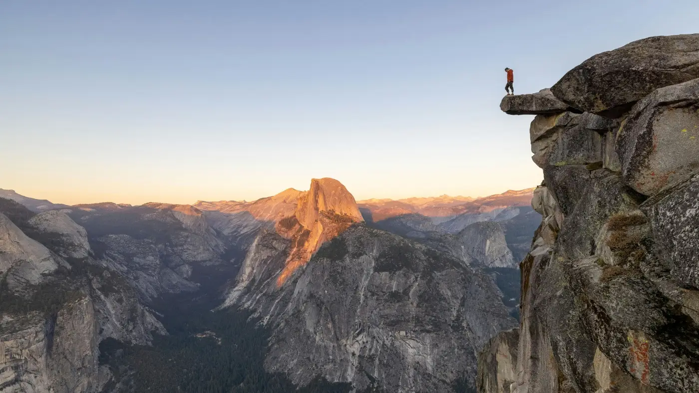 Person standing on the edge of a cliff